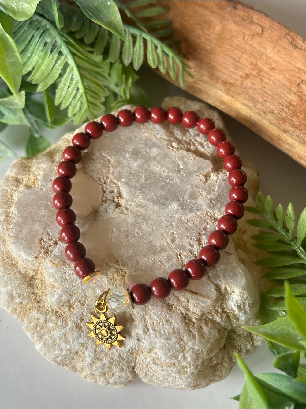 Gold Sunburst Charm Red Glass Bead Bracelet
